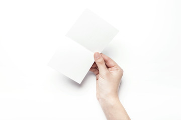 woman hand hold a empty post card isolated white.