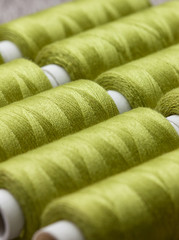green spools of thread