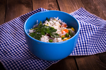 Rice on wooden background