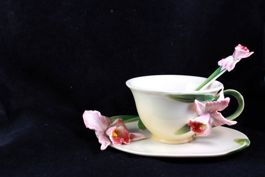 porcelain cup of tea with a lily