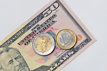 Euro coin on USA dollar