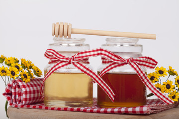 Fototapeta na wymiar Honey in jar on a light background