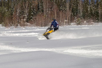 Athlete on a snowmobile