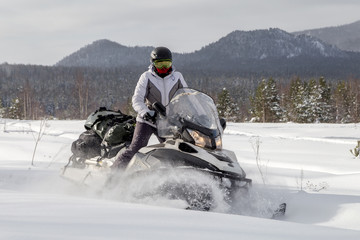 Woman on a snowmobile