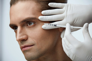 Face Lifting. Handsome Man Getting Facial Beauty Injections