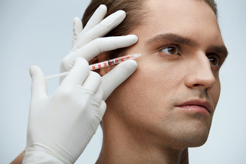 Face Beauty. Portrait Of Handsome Man Getting Facial Injection