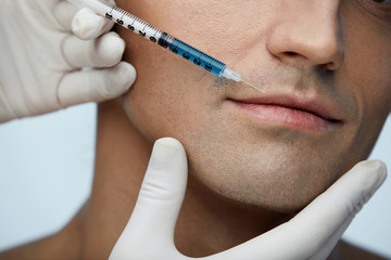 Closeup Of Male Face Getting Facial  Beauty Filler Injections