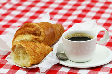 French croissant with cup of black coffee
