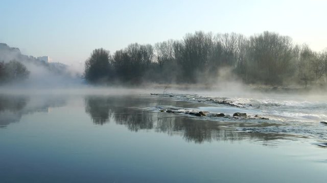 Flowing river in the fog