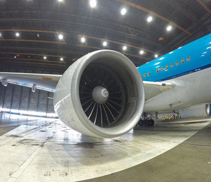 big jet plane inside hangar