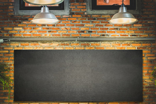 wood frame blackboard backgrounds , menu board with lamp and light on wall in restaurant
