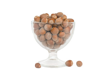 in a glass full of dry hazelnuts