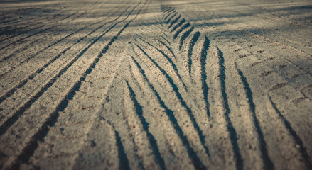 Traces of car tires on the road, close-up