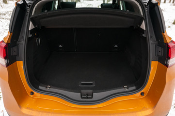 Empty car (minivan) trunk with folded rear seats. A lot of space.