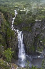Mountain waterfall in forest. Norway