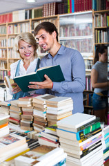 woman and man having books