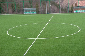 corner in the football field with artificial turf flag