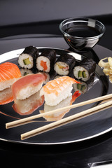 close up of sashimi sushi set with chopsticks and soy - sushi ro