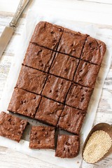 Homemade Quinoa Brownies on white wooden background, selective focus