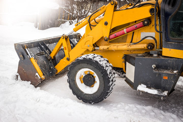 Tractor to clean the snow on the street