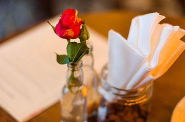red rose flower in cafe.