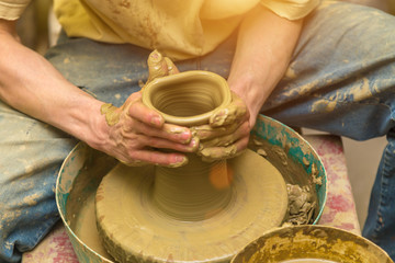 Fototapeta na wymiar potter makes earthen vessel