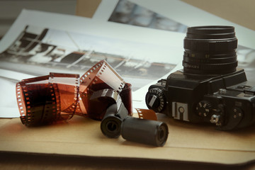 Photographic film rolls, cassettes and camera . Analog film strips Analog photography. - obrazy, fototapety, plakaty