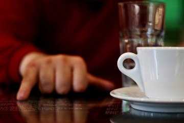 Coffee cup with human hand