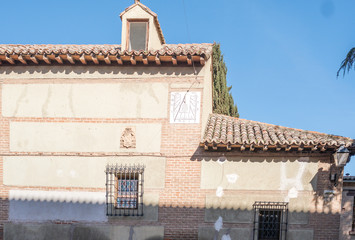 Alcala de henares, madrid, Spain-FEBRUARY 25, 2017. Sundial with inscription in Latin on the facade of the church of "Cristo de los doctrinos"