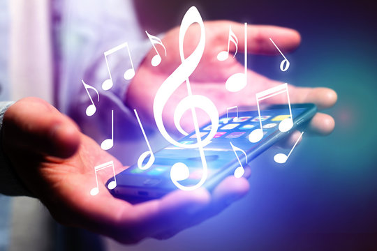 Concept of listenning music on a device - Technology concept