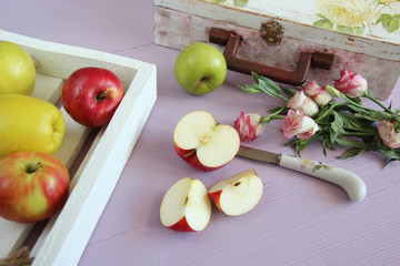 Group of red and yellow apples on the lili background