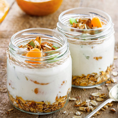 Delicious healthy American breakfast made of granola, yogurt and fruits. Classic US morning meal. Traditional healthy snack.