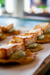 Tostones with abocado and fried cheese