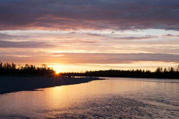 Obraz premium Sunset on the taiga river. River Omulevka. Yakutia. Russia.
