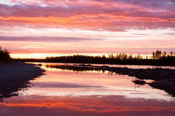 Fototapeta na wymiar Sunset on the taiga river. River Omulevka. Yakutia. Russia.