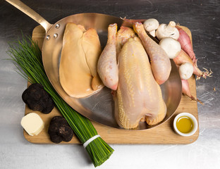 Raw uncooked organic free range chicken with foie gras ingredients, including truffles, chives, mushrooms, olive oil, butter and shallots. © dannyburn