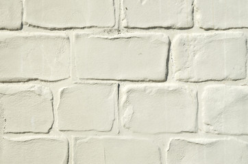 Decorative yellow stucco imitating brick wall