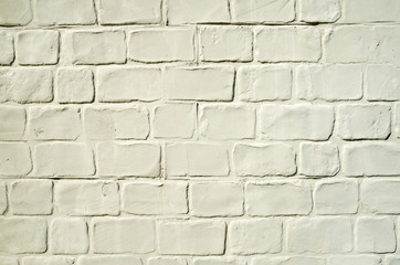 Decorative yellow stucco imitating brick wall