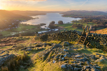 Lake Windermere in the English Lake District taken at sunrise with vibrant colours and golden...