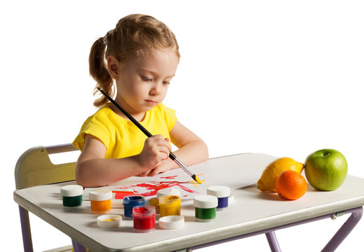 Little cute girl learning to painting, on white background