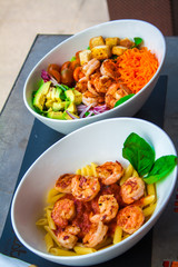 Shrimp salad with abocado in a white bowl
