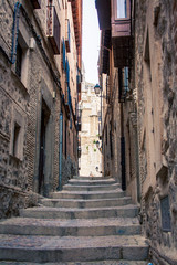 Fototapeta na wymiar narrow street and steps Toledo