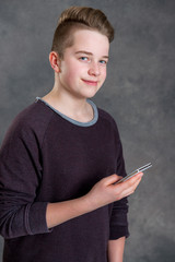 friendly teenager with smartphone