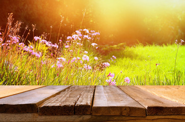 Empty table in front of spring beautiful field flowers