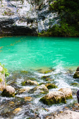 Mountain pond with beautiful green-blue water.