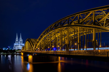 Cologne cathedral and Hohenzollernbruecke in Cologne Germany at night