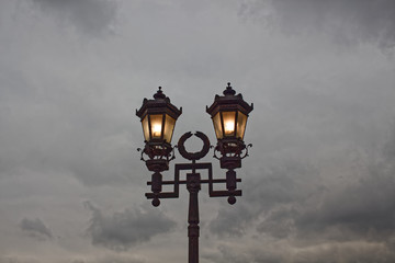 Fototapeta na wymiar evening, lights, street lamp, light, city, arihitektura, iron lantern,