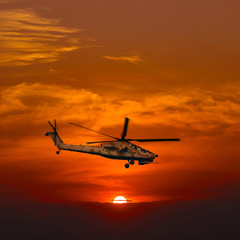 Naklejka na ściany i meble Helicopters at warm sunset