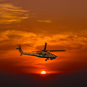 Helicopters at warm sunset