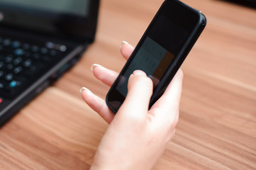 Closeup of hands of beautiful business woman working with computer in her office